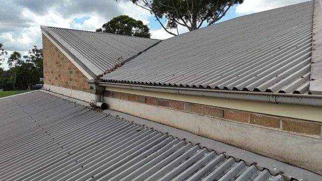 Eaves gutter along the roof perimeter