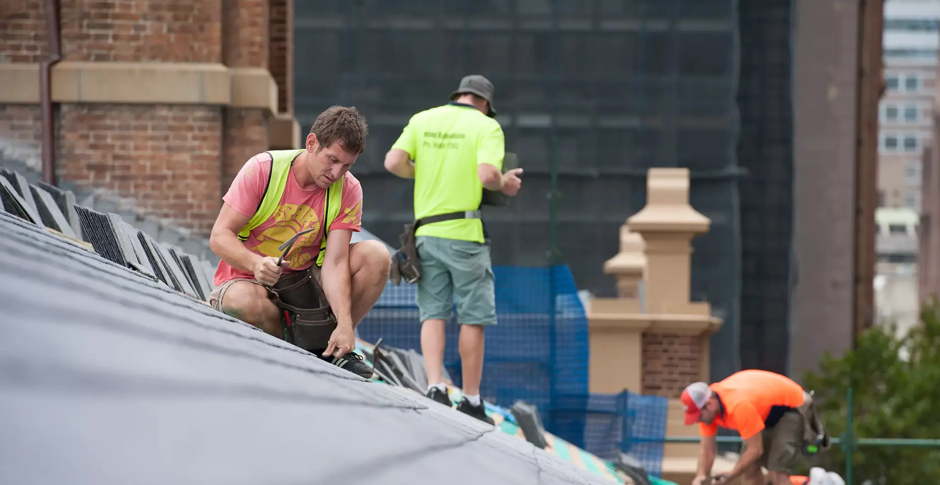 banner_image_men_on_roof